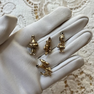 Four Vintage 1960&#39;s Figural Wizard of Oz Gold Tone Charms, Dorothy, Scarecrow, Tin Man, and Toto
