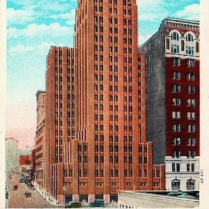 May include: Vintage postcard featuring the Northern Life Building in Seattle, Washington. The tall, brick building has a stepped design and is topped with a flag. The sky is blue with white clouds. The postcard is a vintage item.
