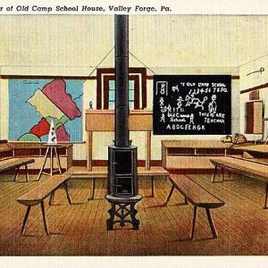 May include: Vintage postcard image of the interior of the Old Camp School House in Valley Forge, Pennsylvania. The room features wooden benches, a map, a chalkboard with text, and a central stove. The room has a warm, inviting atmosphere.