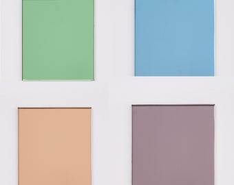 May include: Four square samples of colored glass, each with a different color: green, blue, orange, and purple.