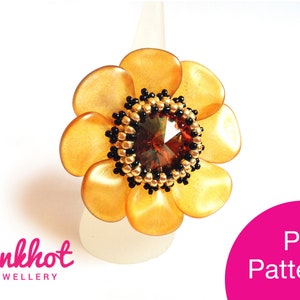 May include: A gold and black beaded flower ring with a brown crystal center. The ring is on a white display stand. PDF Pattern.