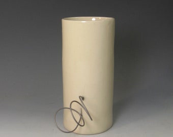 hand built porcelain cup  ...   nichrome wire loopy handle   ...     mid century modern with a twist