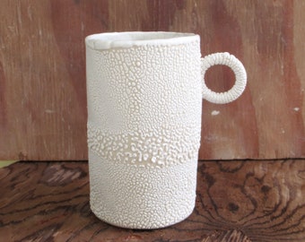 hand built porcelain cup  ...  white crawl glaze  ....   snow and ice