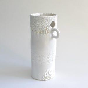 hand built porcelain vessel   ...  white crawl glaze  ...  hand made vase  ...  mid century modern ... melting  snow and ice