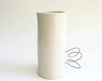 hand built porcelain vessel  ...   nichrome wire loopy handle   ...   handmade  mid century modern ceramic with a twist