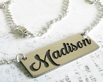Cursive name necklace in sterling silver. Personalized word script pendant.