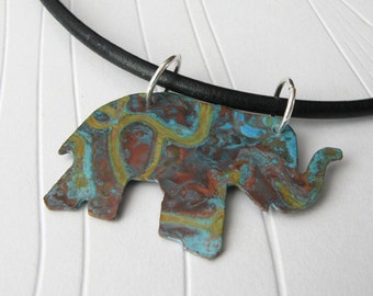 Verdigris elephant necklace.  Rustic copper patina on leather cord with sterling silver clasp.  Organic animal jewelry for her.
