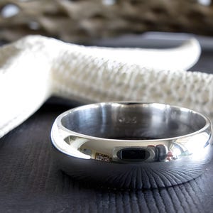Sterling silver wedding ring.  Artisan handmade 6mm domed band.  Smooth polished finished. Classic jewelry. His or hers.