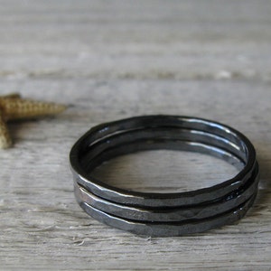 Trio of minimalist hammered stacking rings handmade from oxidized sterling silver