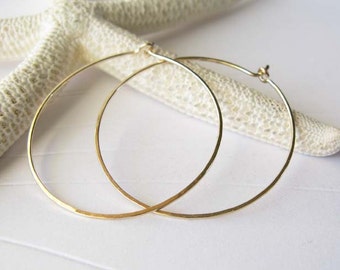Minimalist thin 1 3/8" 20 gauge hoops available in sterling silver, gold-filled, 14k yellow gold, 14k rose gold, 14k white gold, 18k gold