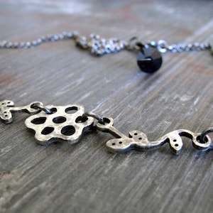 Flower and vines antiqued sterling silver necklace.  You choose crystal colors.