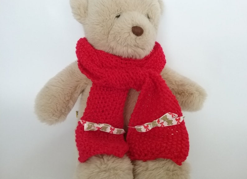 teddy bear with red scarf