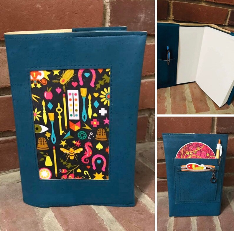 May include: A teal blue notebook cover with a colorful patterned window. The cover has a zippered pocket on the back with a key chain.