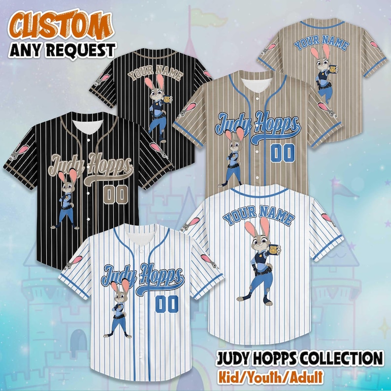 May include: Baseball jerseys with custom designs. The jerseys feature a cartoon rabbit character and the text "Judy Hopps" and "Your Name". The jerseys are available in black, white, and tan with blue and white stripes. The text "JUDY HOPPS COLLECTION Kid/Youth/Adult" is also visible.