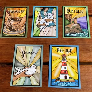 May include: Five art cards with religious themes. Each card features a different image and word: "Purposed," "Safe," "Fortress," "Peace," and "Refuge." The cards have a stained-glass style with vibrant colours and bold outlines.