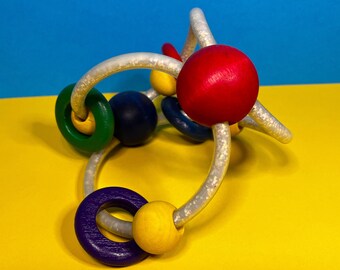 Tactile Toy - Rattle - Colourful - Wooden Rings - Soft Plastic - Imagination - Learning - 1990s - Manhattan Toy Company - Ely Raman