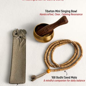 May include: A Tibetan meditation gift set including a ceramic incense holder, a mini singing bowl with a wooden mallet, and a 168 Bodhi seed mala. The set is designed for calm and clarity. The text on the image reads "Tibetan Meditation Gift Box".
