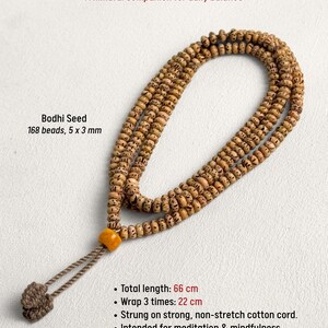May include: A Bodhi Seed Mala necklace with 168 beads, each 5 x 3 mm. The total length is 26 inches. The necklace is strung on a strong, non-stretch cotton cord. The text reads: "A mindful companion for daily balance."