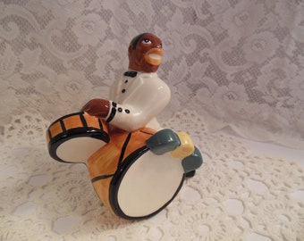 Vintage ceramic black musician figurine - dressed in tuxedo playing drums from circa 1950s - 1960s