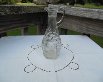 vintage Circa 1960s vintage clear glass oil or vinegar decanter with handle