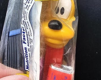 pez dispenser Disneys Pluto dog red circa 1990s new in original package unused