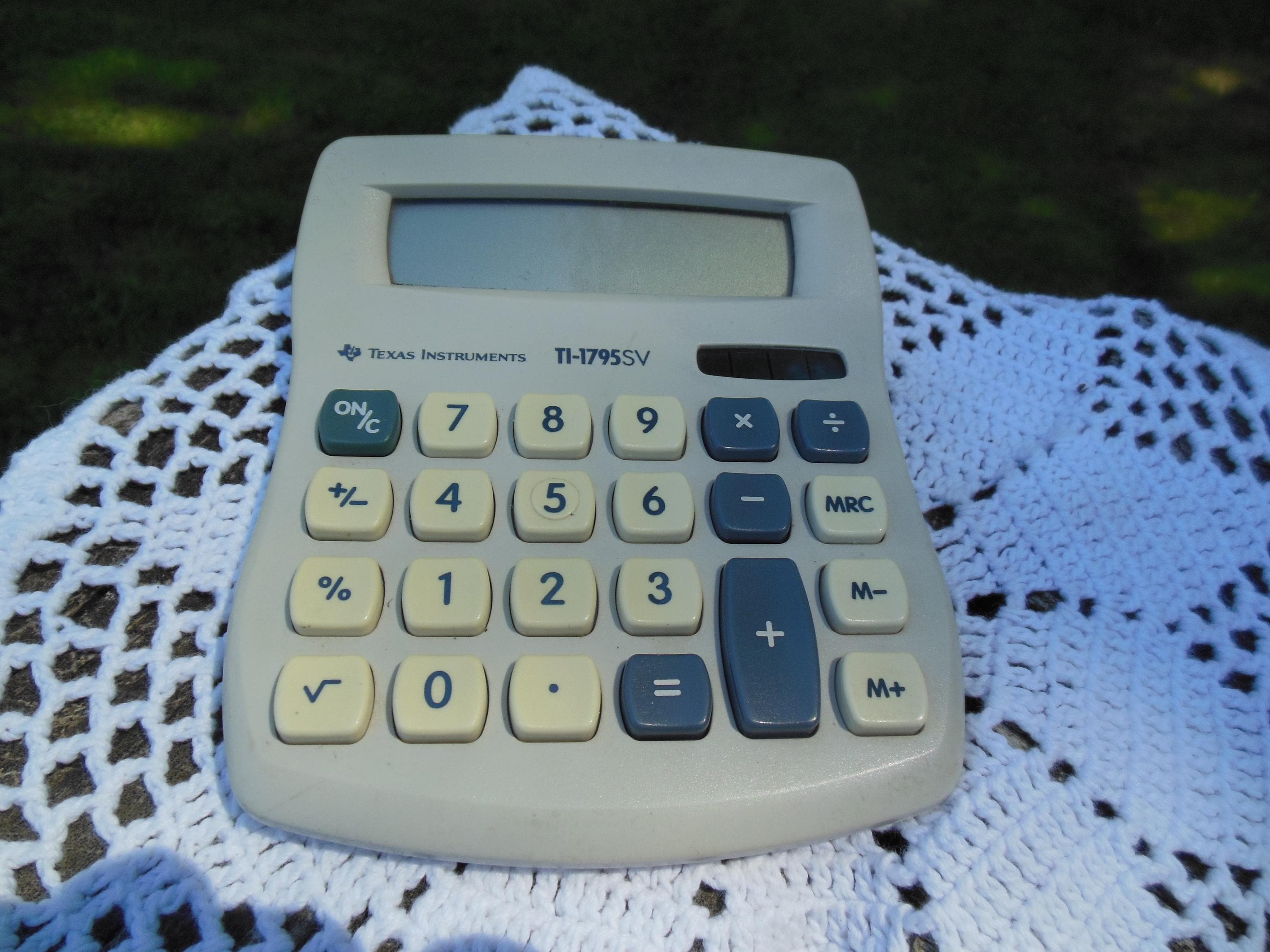 A collection of vintage calculators including slide rules and early
