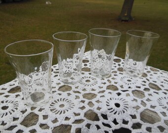 vintage shot glasses Set of 4 clear glass unadorned no maker's mark circa 1960s  appear to be new / unused delicate wavy glass