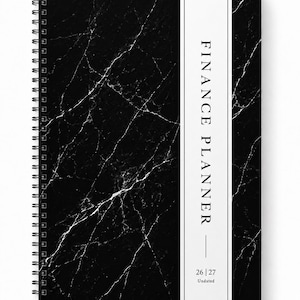 May include: A spiral-bound finance planner featuring a black marble pattern cover with a vertical white stripe on the right side. The text FINANCE PLANNER is printed in black, followed by the numbers 26 | 27 and the word Undated at the bottom.
