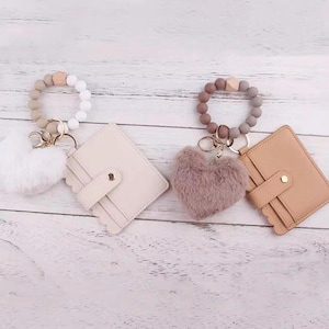 Monedero de pulsera con pompón de corazón: tarjetero minimalista con cremallera, llavero en rosa, tostado, azul, marfil y morado, monedero.