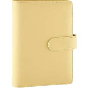 May include: A pale yellow leather bound journal with a flap closure. The journal has a stitched edge and a smooth, matte finish.