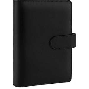 May include: A black leather planner with a flap closure and a strap. The planner has a smooth, textured surface.