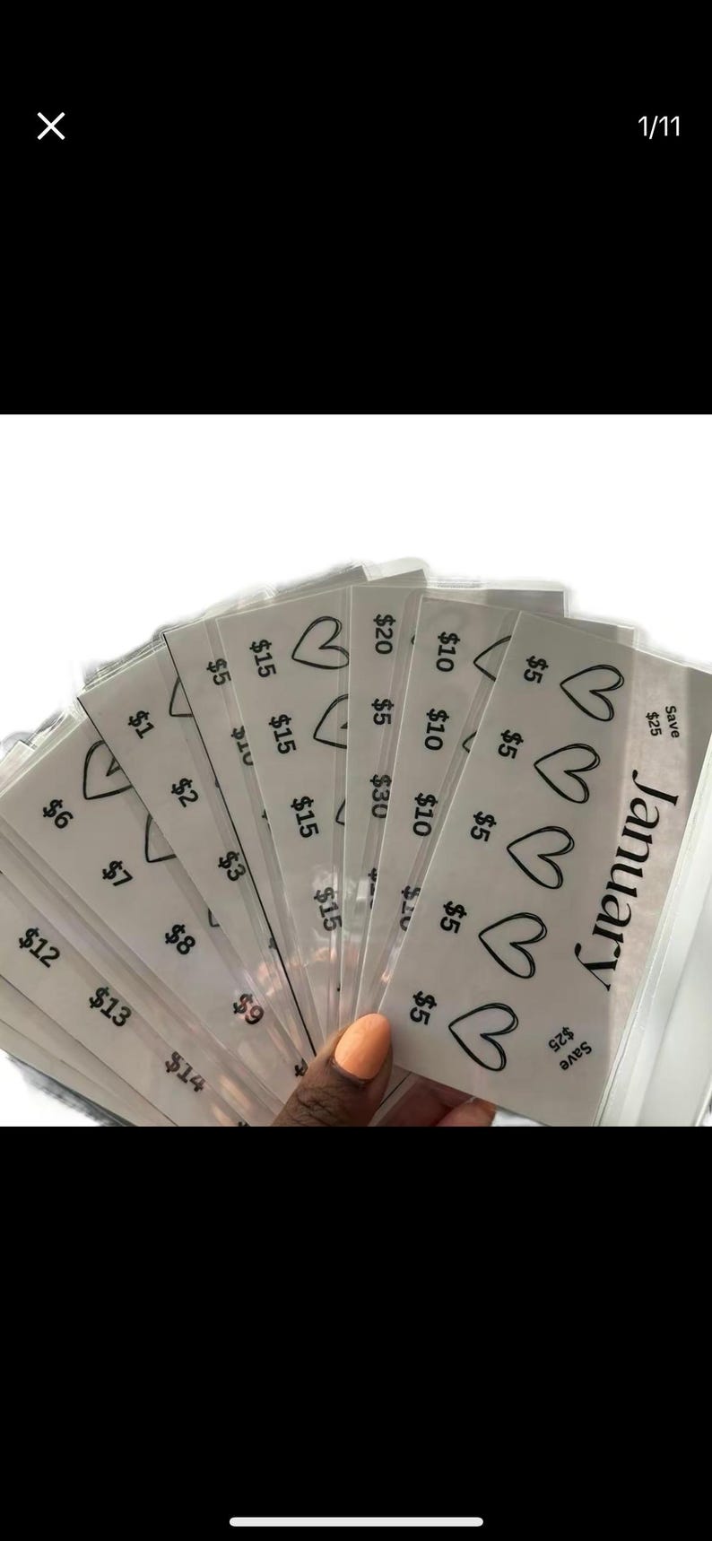 May include: A stack of white gift cards with a heart design and the text "January" and "Save $25" on the top card. The cards have different dollar amounts printed on them, ranging from $1 to $20.