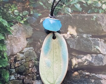 Ceramic leaf necklace with glass bead by Styx River Art
