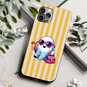 May include: A phone case with a yellow and white striped design. The case features a cartoon ghost wearing pink sunglasses and holding a cocktail and a pink handbag. The ghost has a blue cape with colourful stars.