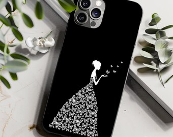 May include: Black phone case with a white silhouette of a person in a dress made of butterflies. The person is holding out their hand, with butterflies fluttering around them. The case has a glossy finish.
