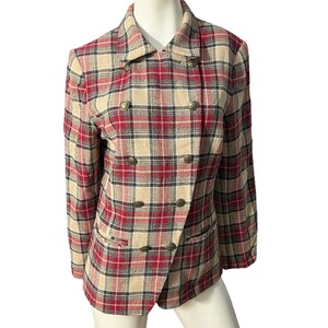 May include: A double-breasted plaid blazer in red, beige, and black. The blazer has a classic collar, two front pockets, and gold-coloured buttons. The plaid pattern is a traditional design, suitable for a variety of occasions.