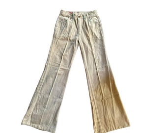 May include: A pair of wide-leg, light brown corduroy pants with a faded ombre effect from light to dark brown.