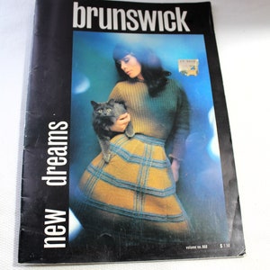 May include: A vintage knitting pattern booklet titled "Brunswick new dreams" featuring a woman in a brown and blue plaid skirt and a grey sweater holding a grey cat. The booklet is volume no. 668 and costs £1.50.