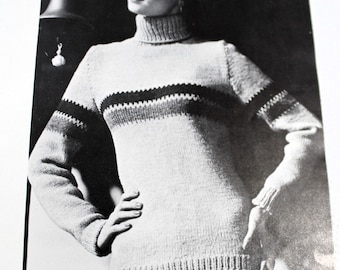 May include: A black and white photo of a woman wearing a knitted sweater with horizontal stripes. The sweater has a turtleneck collar and long sleeves.