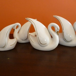 4 White Porcelain Swans
