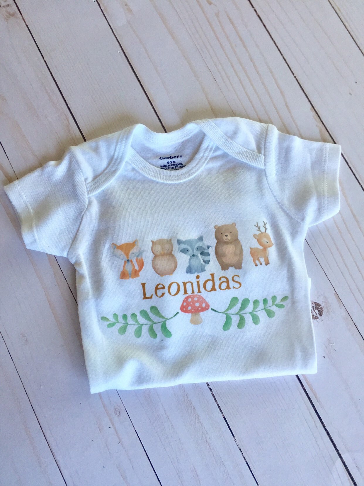 woodland baby onesies