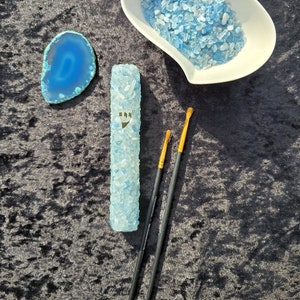 Aquamarine - A mezuzah case made of crystal stones offers a luxurious and spiritual touch to a traditional Jewish symbol.