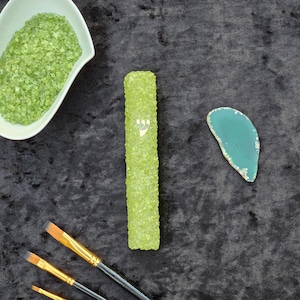 Olivine - A mezuzah case made of crystal stones offers a luxurious and spiritual touch to a traditional Jewish symbol.