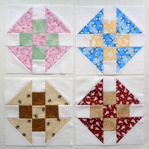 May include: Four fabric squares with a white background and a diamond-shaped pattern in the center. The patterns are made up of different colored fabrics with various designs, including bees, flowers, and animals.