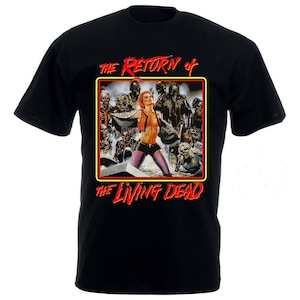 May include: Black t-shirt featuring a movie poster design. The poster has a red and yellow border with the text "THE RETURN of THE LIVING DEAD" in red. The graphic depicts a woman and zombies.