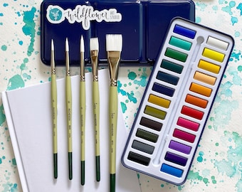 Deluxe Watercolor Paint & Brushes • 24 Artist-Grade Watercolor Paints in Travel Set • 5 Paintbrushes with Sketchbook • Art Kit for Adults