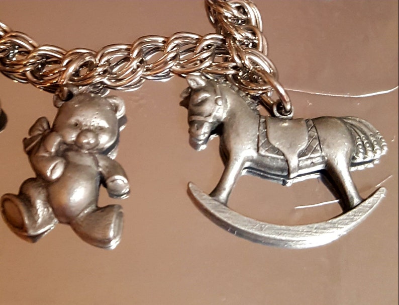 432 Vintage 7 Charms Pewter on a Stainless Steel Charm Bracelet