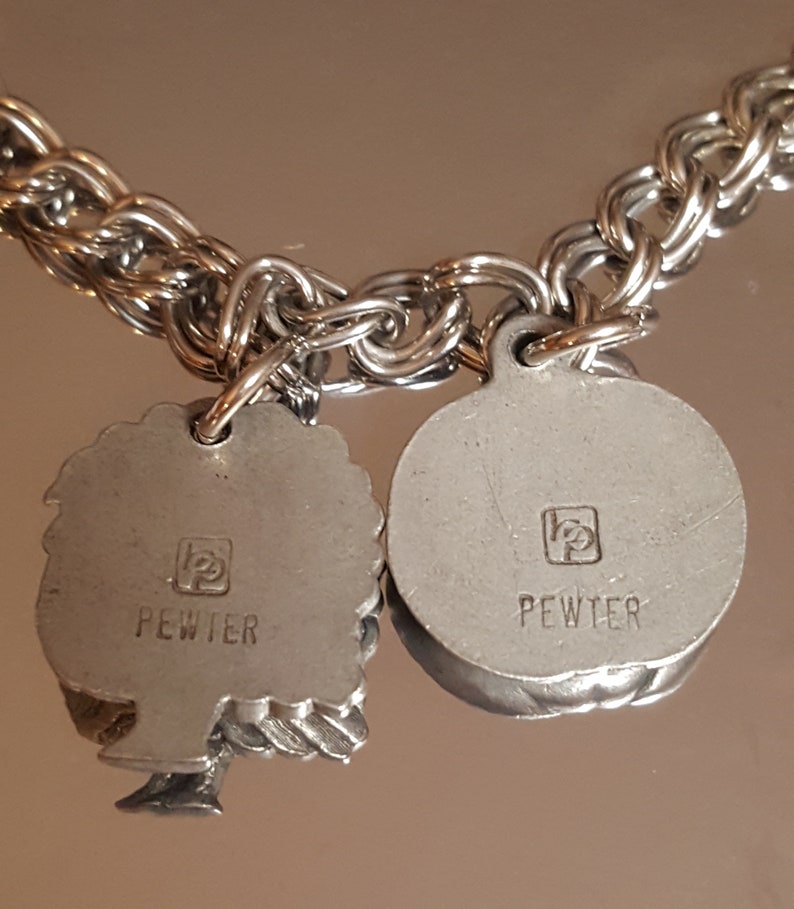 432 Vintage 7 Charms Pewter on a Stainless Steel Charm Bracelet