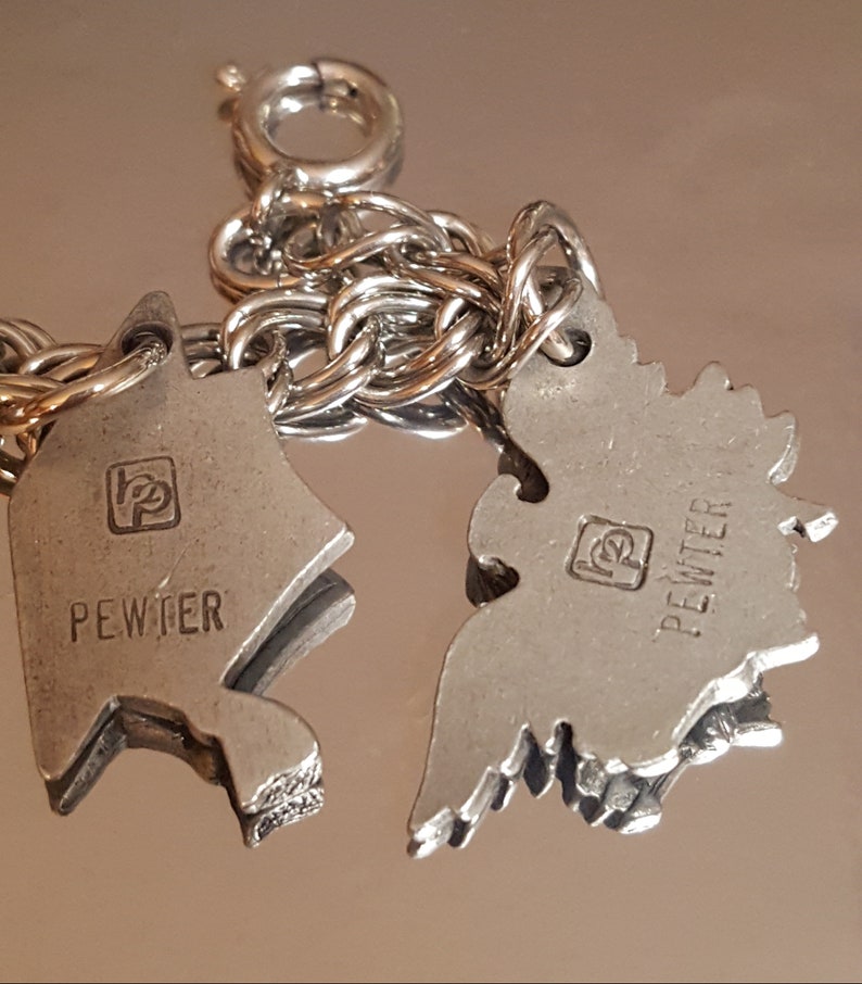 432 Vintage 7 Charms Pewter on a Stainless Steel Charm Bracelet