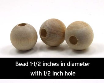 May include: Three natural wood beads, each 1-1/2 inches in diameter with a 1/2 inch hole.